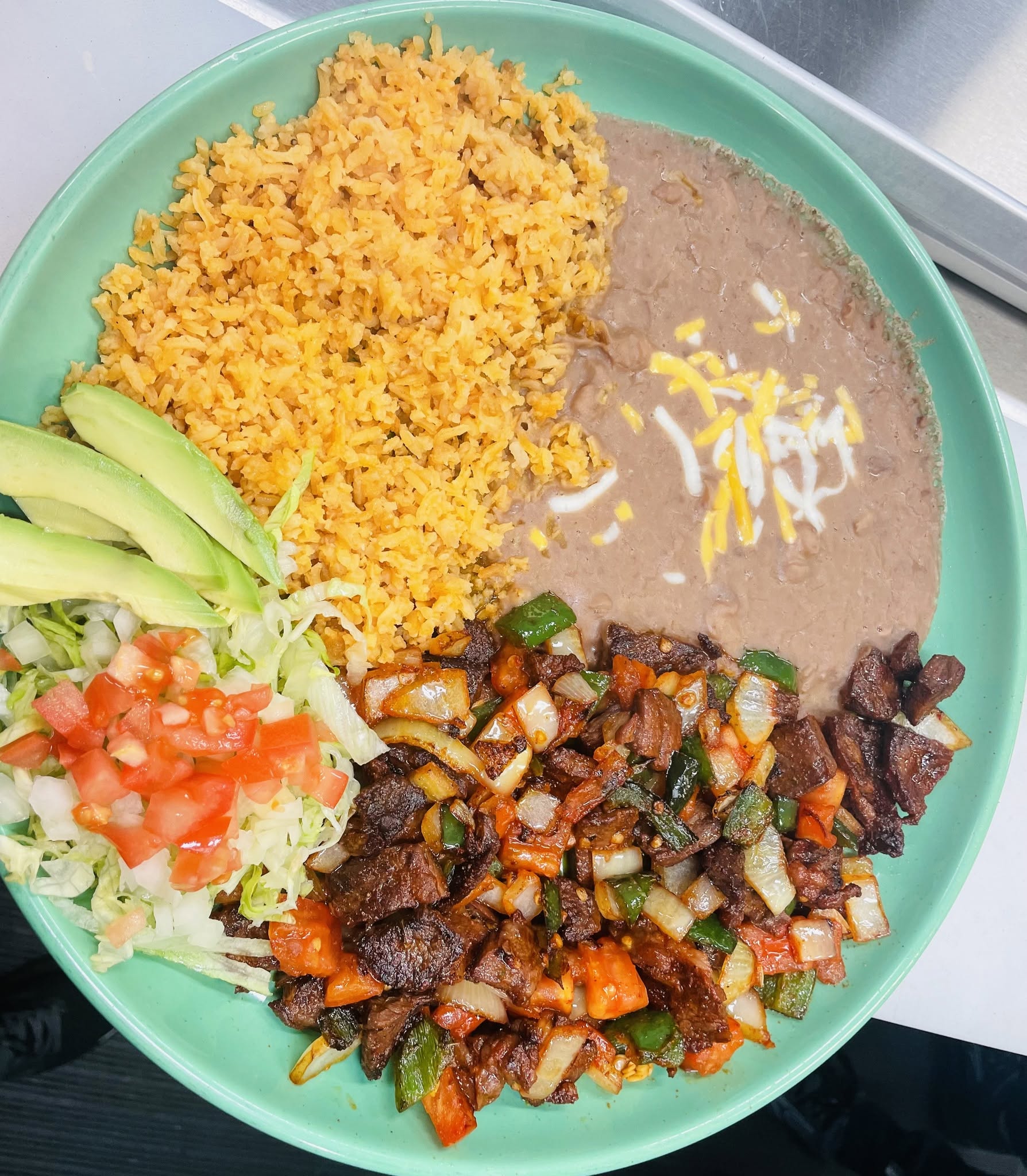 Carne asada plate with rice, beans and tortillas at Jake's Meats